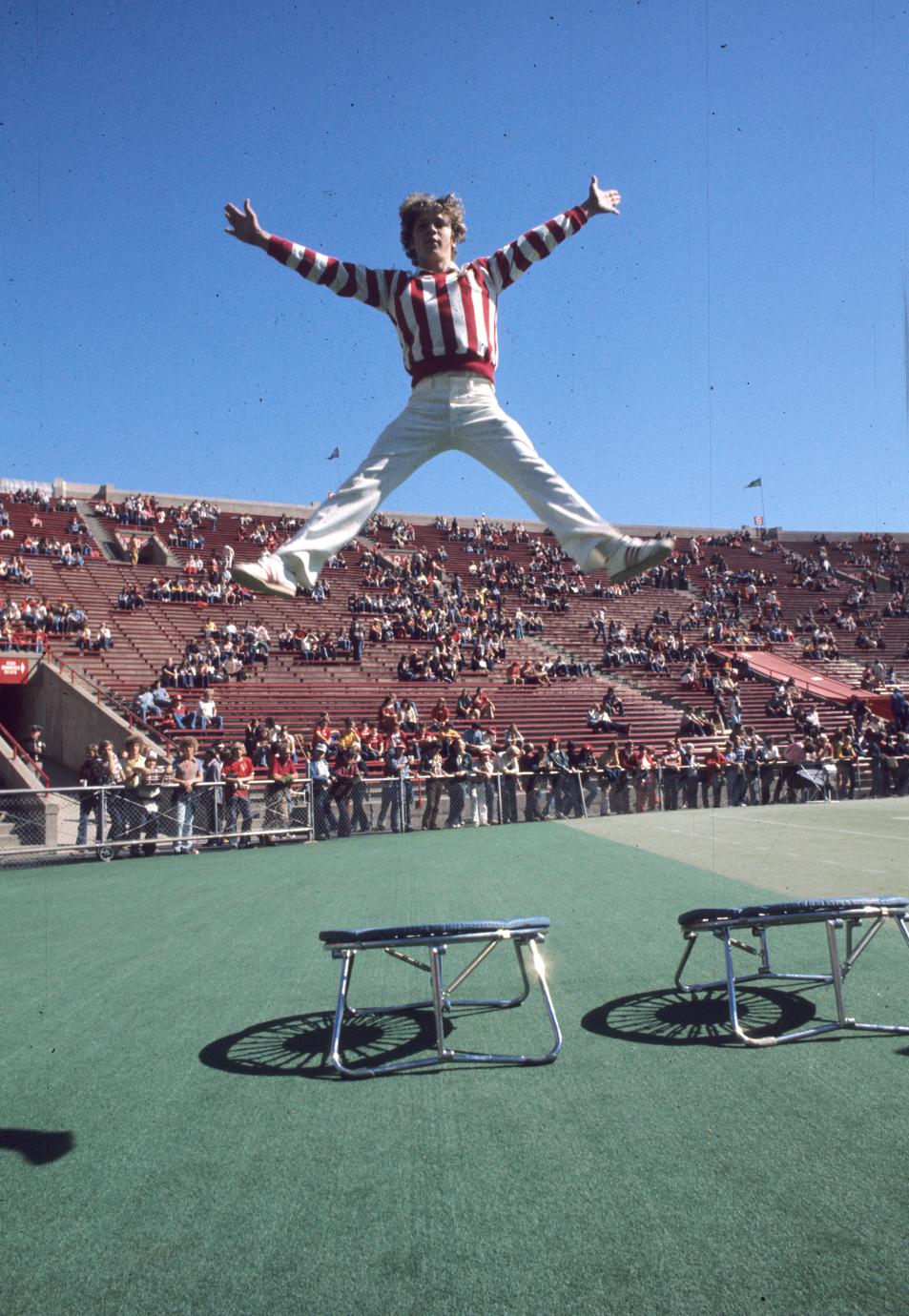 Cheerleader jumping on trampoline UW Digital Collections photo