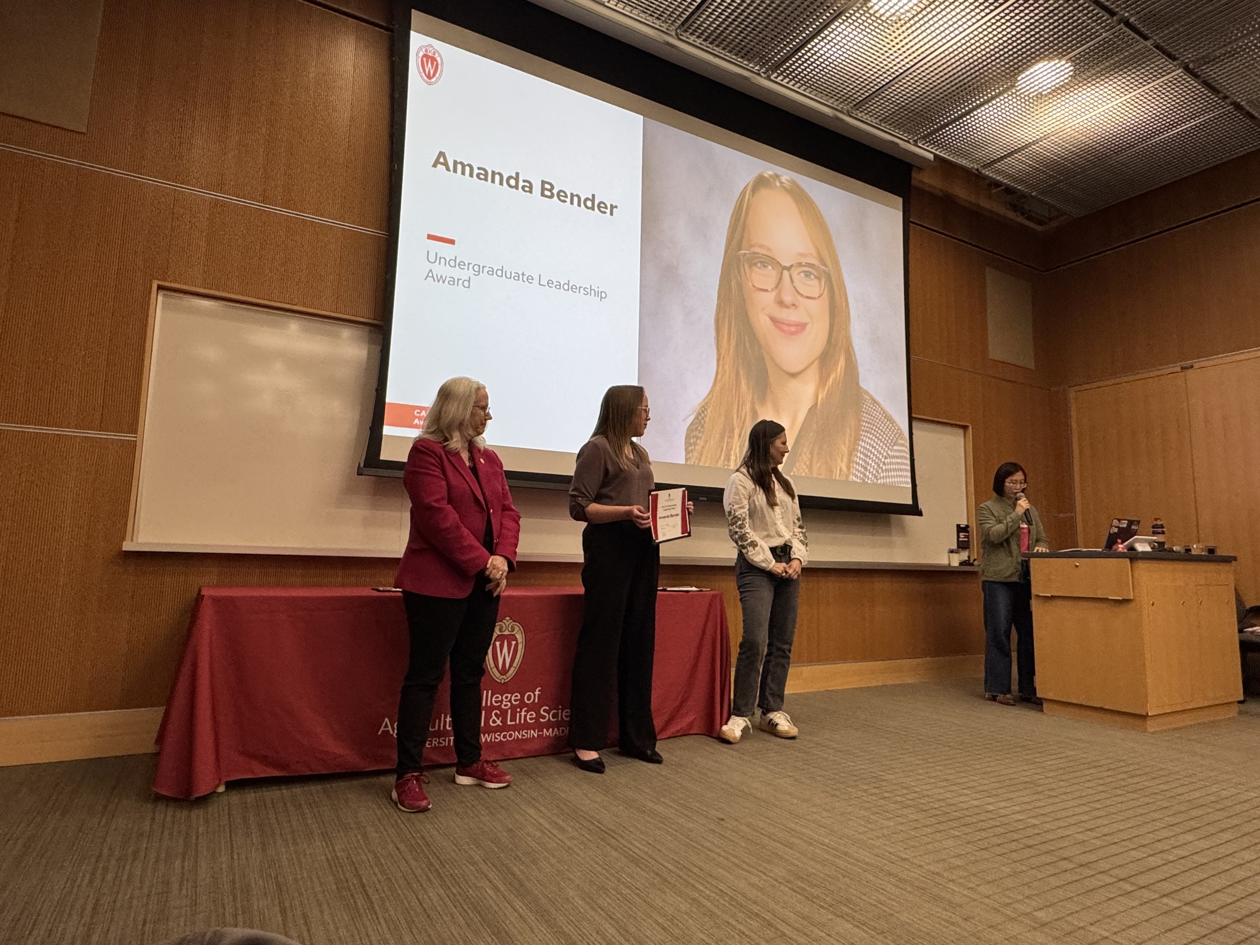 Amanda Bender receives an award from Dean Glenda Gillaspy