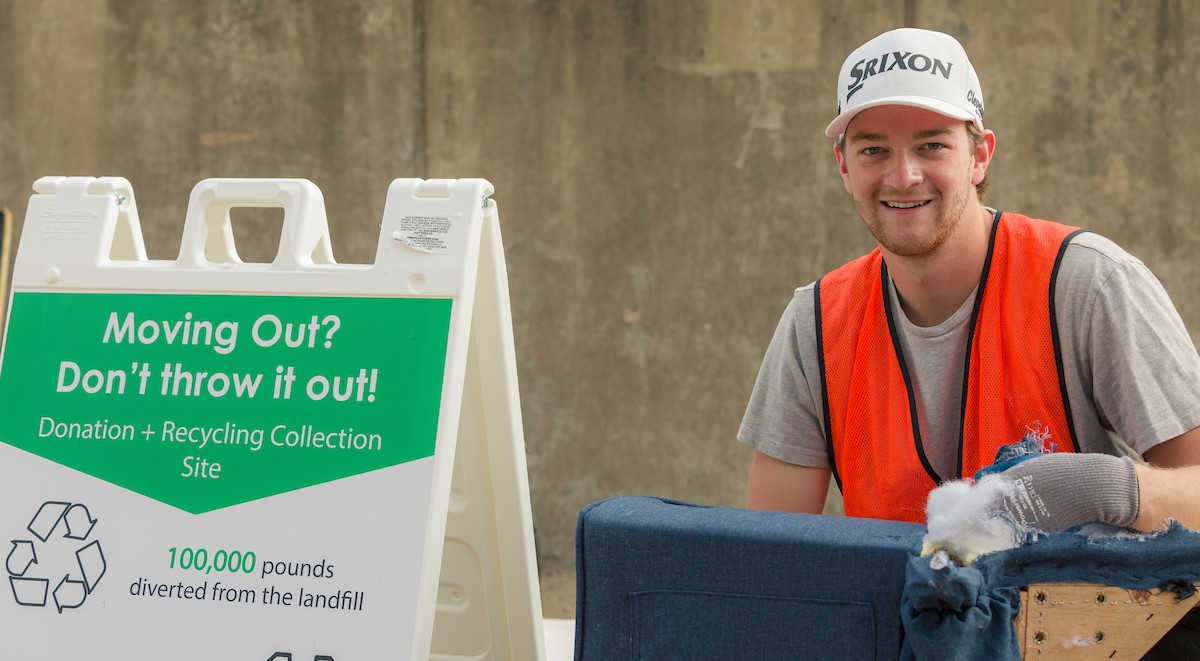 Sustainable move-out volunteer helping with furniture recycling