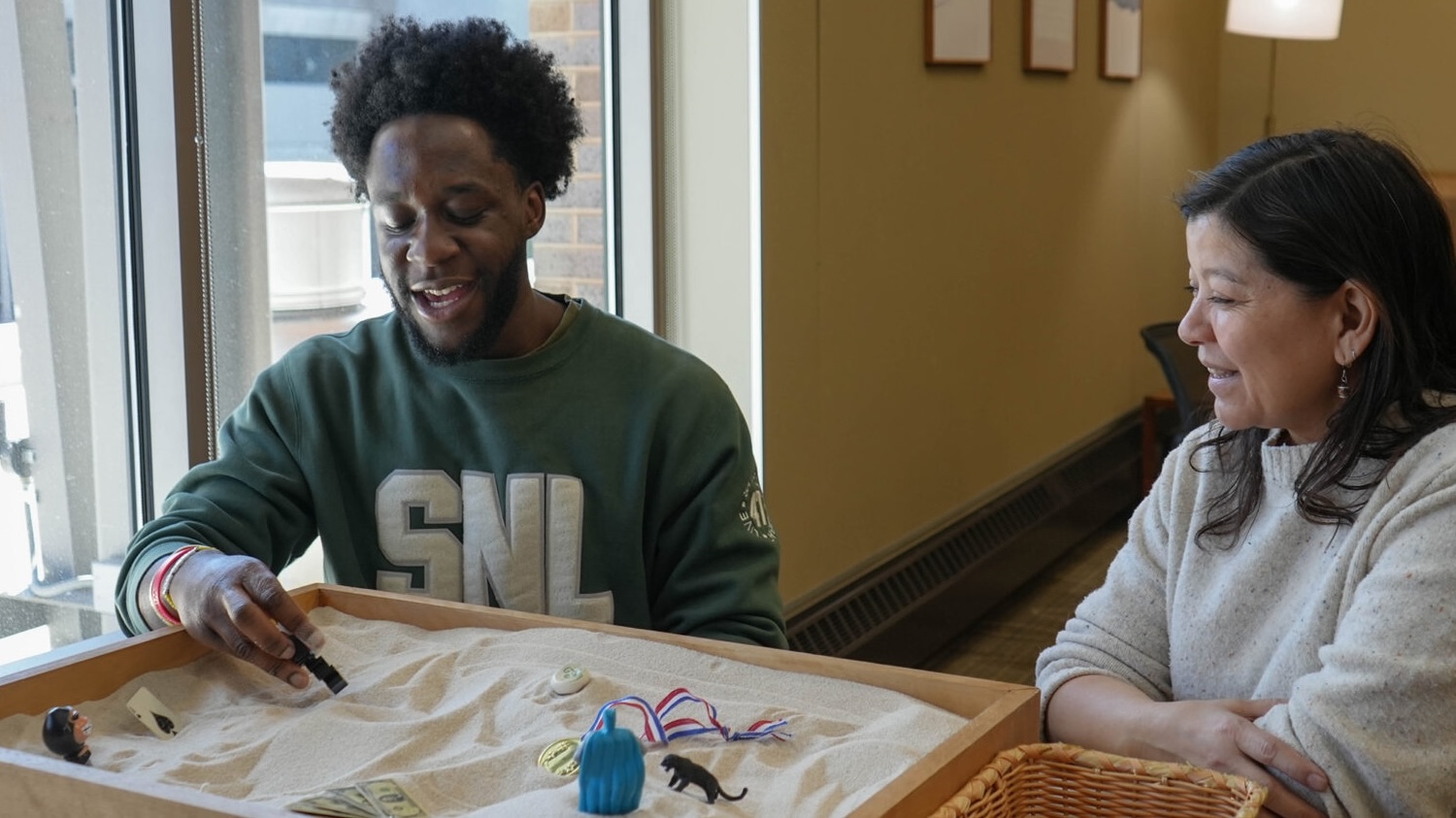 Student participating in a Sand Tray Exploration