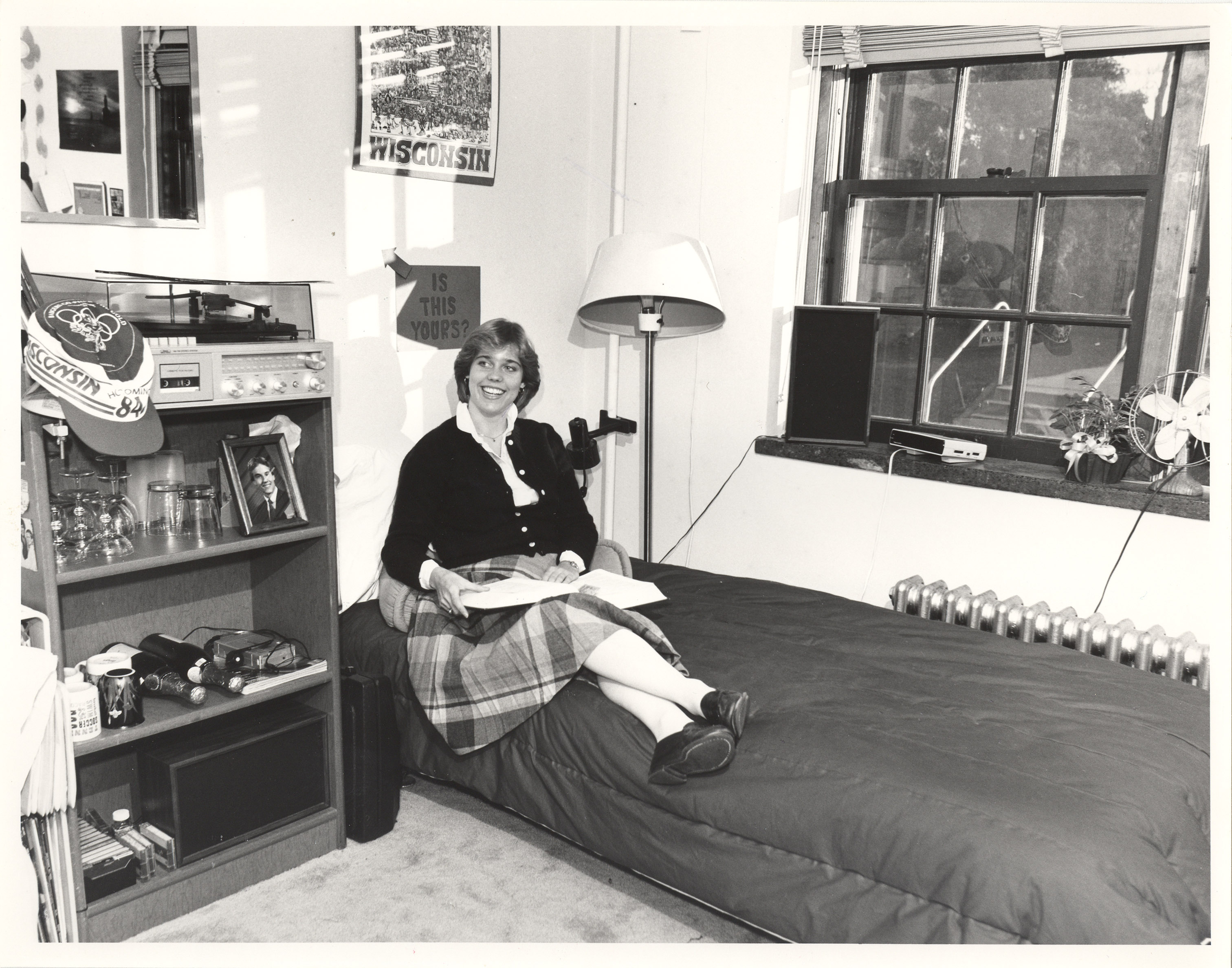 A student reading a textbook in the Residence Hall