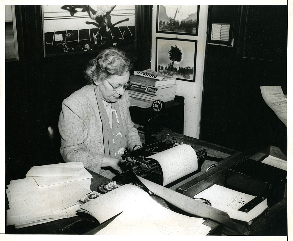Renee Harris working at a typewriter.