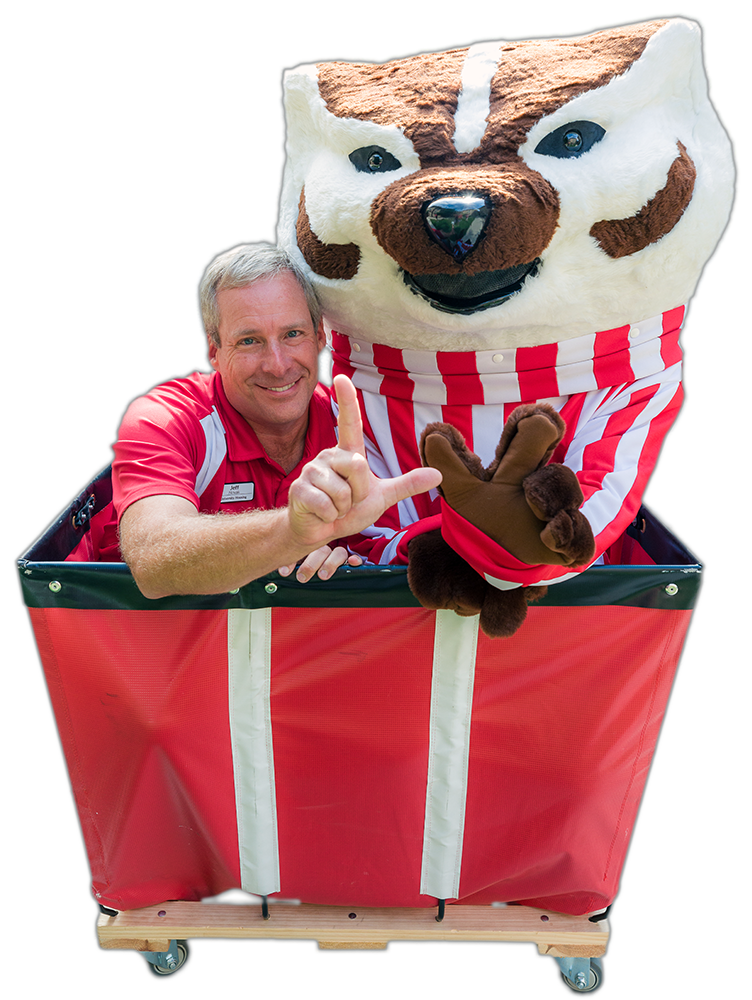 Jeff Novak and Bucky Badger sit in a cart and form the letter "W" with their hands