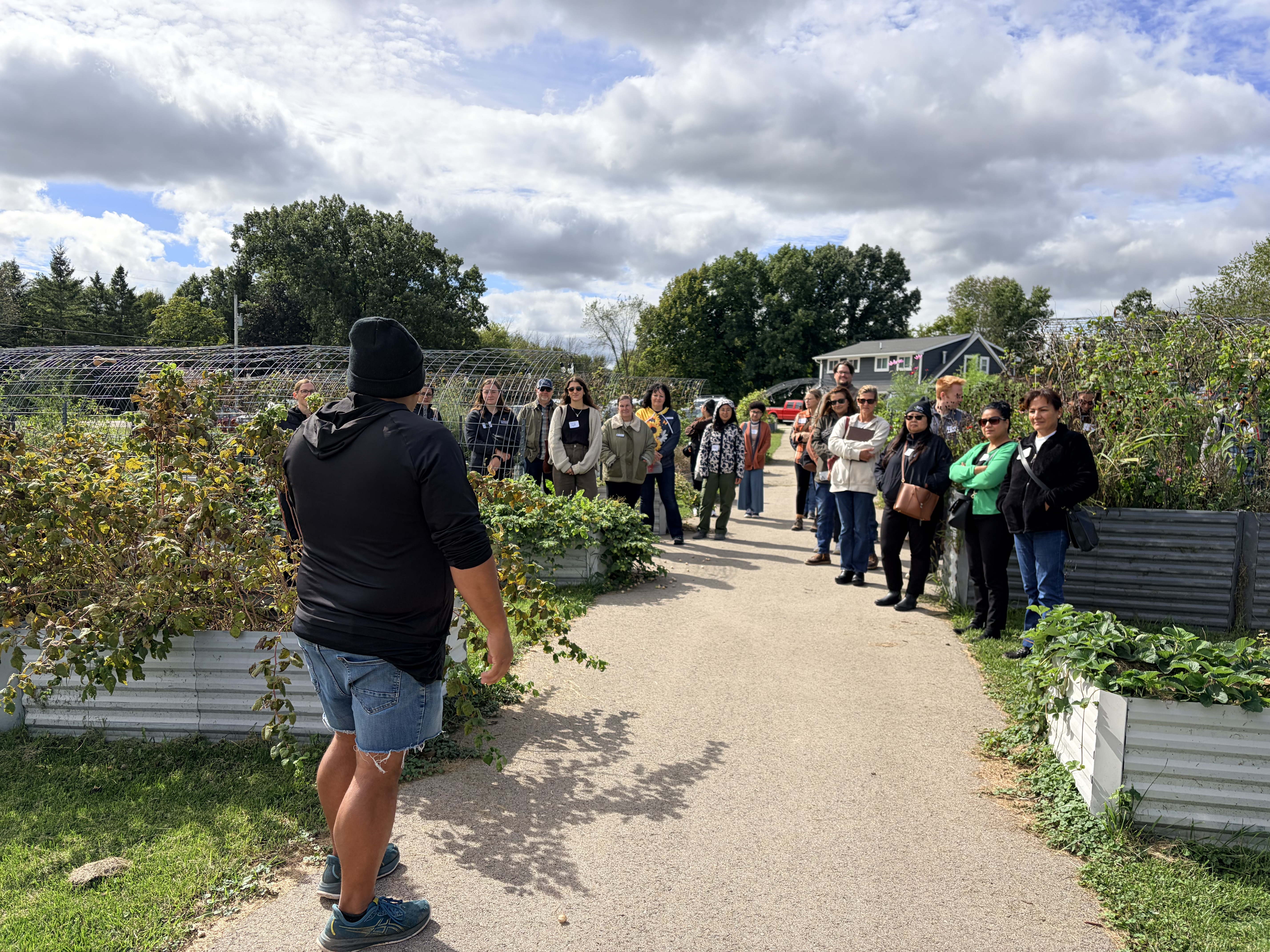 Steve Webster leads a farm tour with event partcipants 