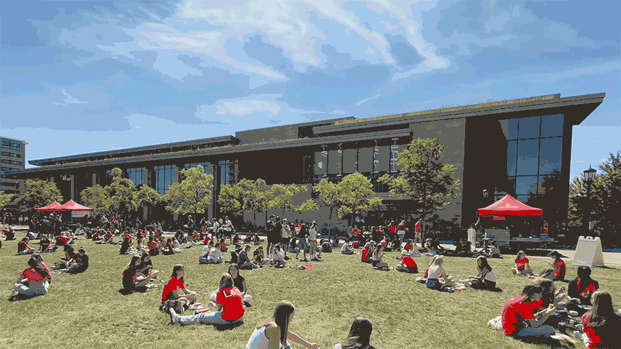 Students sitting and walking outside the Gordon Dining & Event Center with text overlaid reading "Last chance to #LiveWithBucky this fall!"