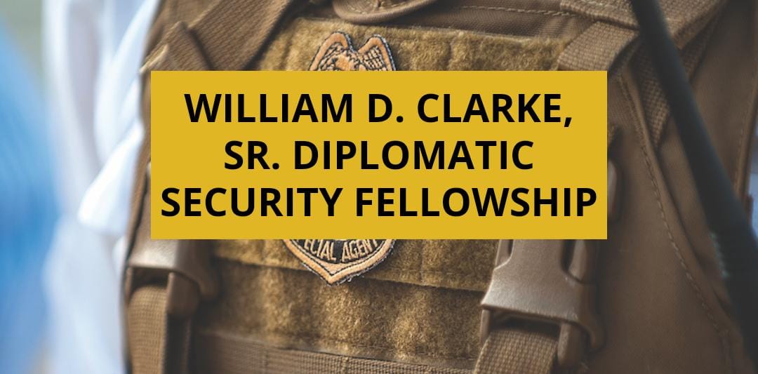 A photo of a Special Agent badge under the inscription "William D. Clarke, Sr. Diplomatic Security Fellowship."