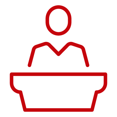 Person behind desk icon